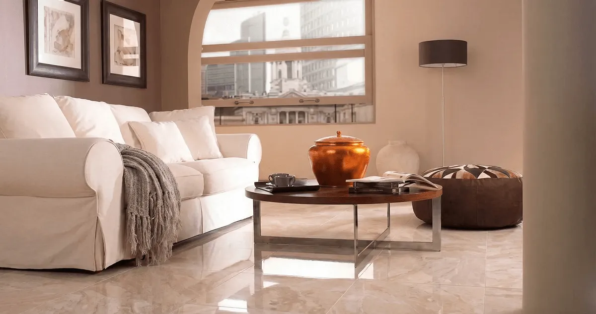 Modern living room with professionally installed marble flooring, a beige sofa, coffee table in Knoxville, TN