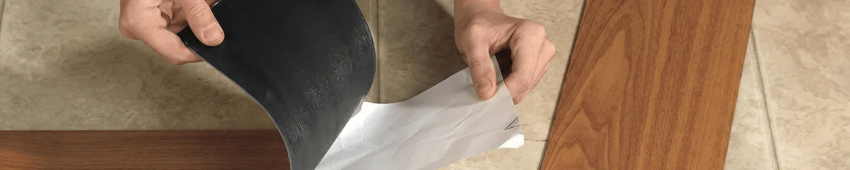 A professional installing vinyl flooring in Knoxville, TN